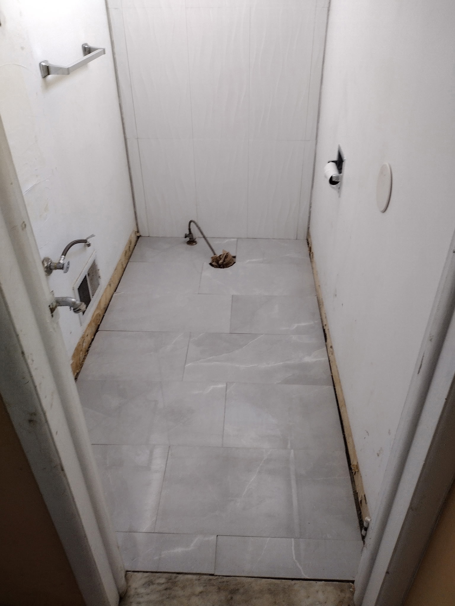 Laying flooring in half-bathroom
