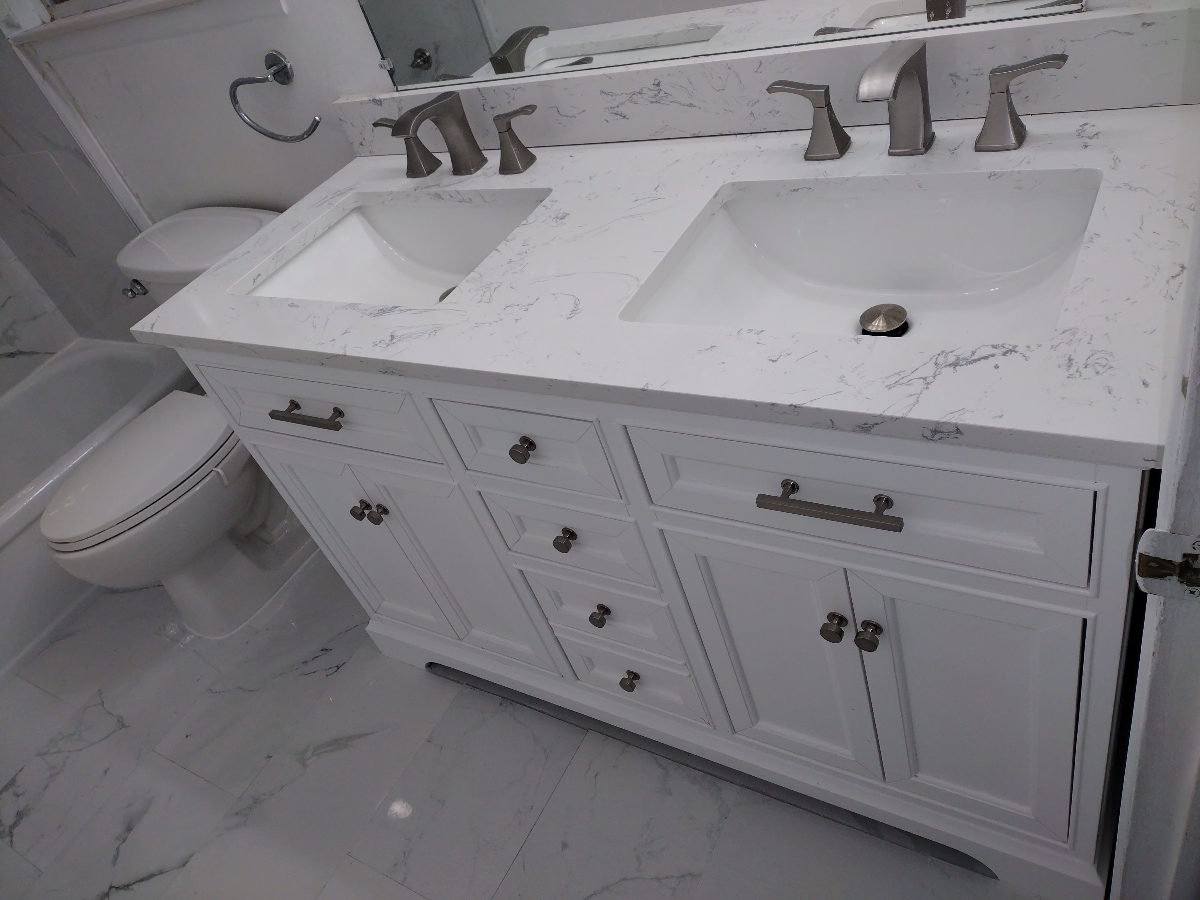 Double vanity marble countertop bathroom by J.D. Higgins LLC