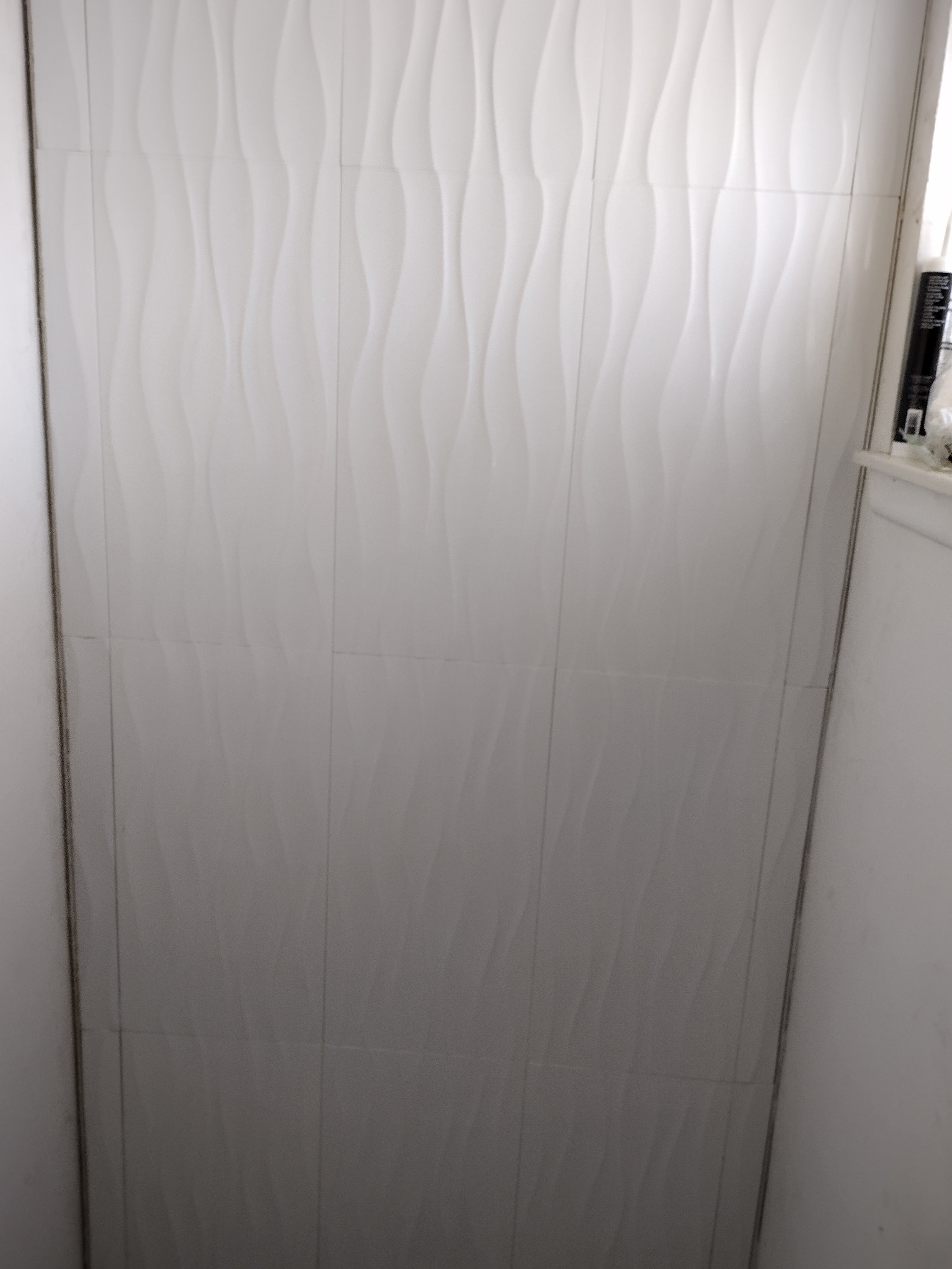 Tile cutting in progress for half-bath renovation