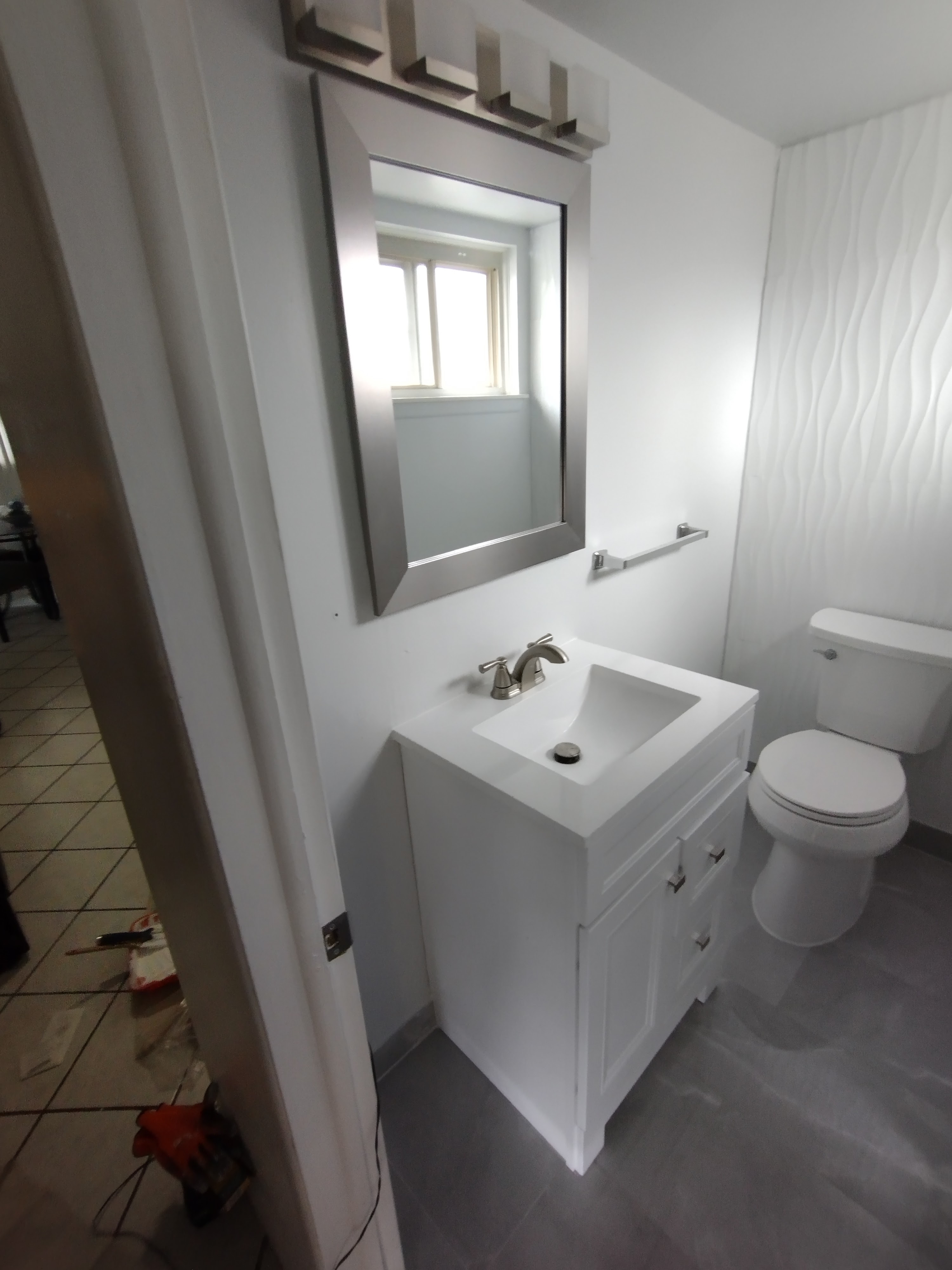Another angle of finished half-bath showing all fixtures